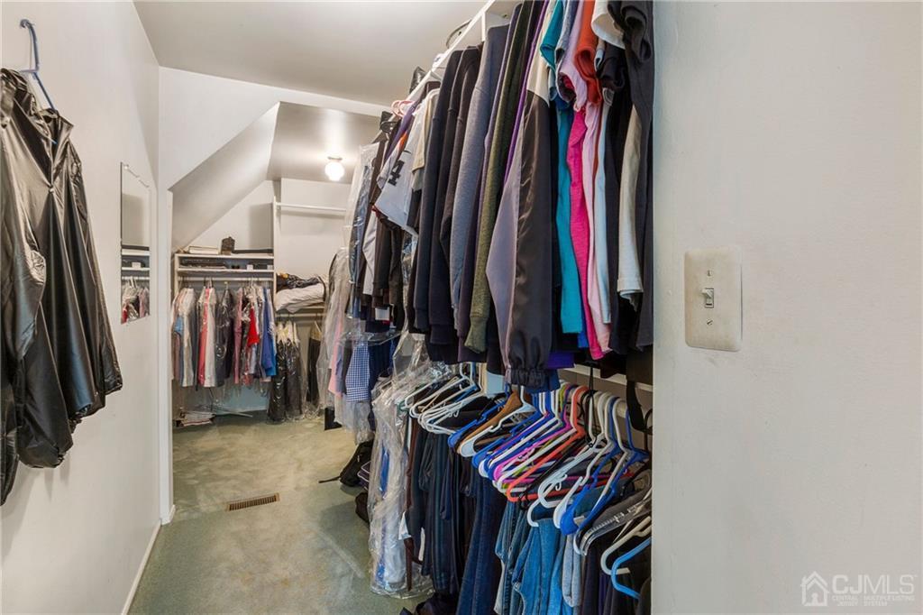 461 Cottrell Road Old Bridge, NJ 08857 - Photo 10 of 21 a view of walk in closet with clothes