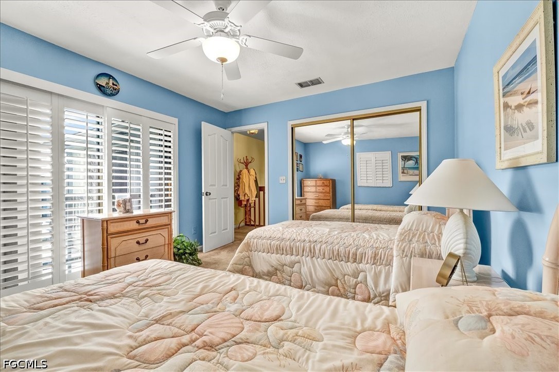 707 Hoover Dike Road, Unit 904 Clewiston, FL 33440 - Photo 34 of 41 a bedroom with a large bed and a chandelier