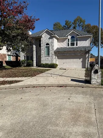 front view of a house with a road
