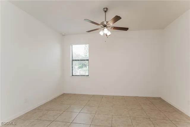 an empty room that has a window in it