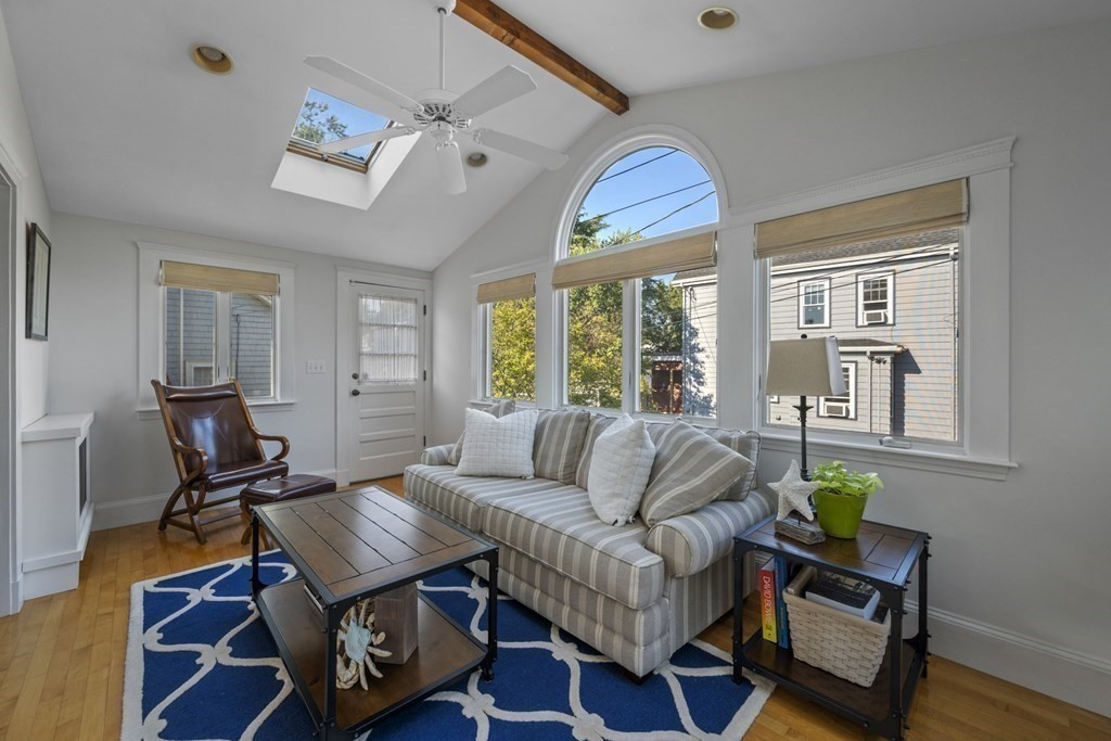 64 Farragut Road Swampscott, MA 01907 - Photo 11 of 35 a living room with furniture a wooden floor and a window