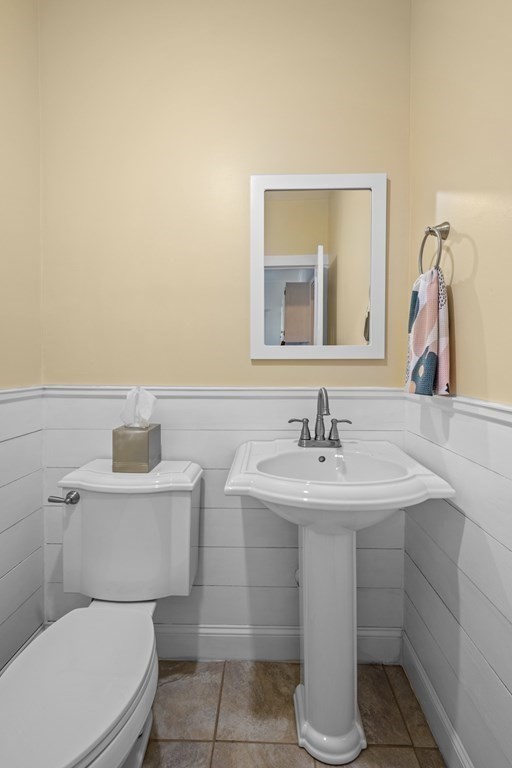 64 Farragut Road Swampscott, MA 01907 - Photo 18 of 35 a bathroom with a toilet sink and mirror