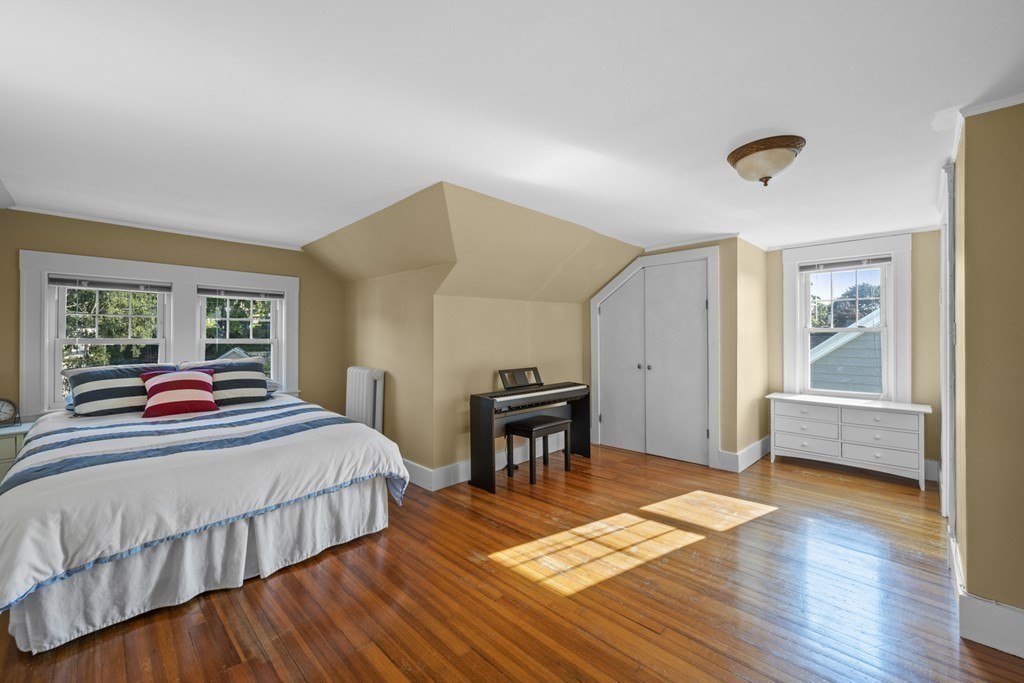 64 Farragut Road Swampscott, MA 01907 - Photo 29 of 35 a bedroom with a bed and a table