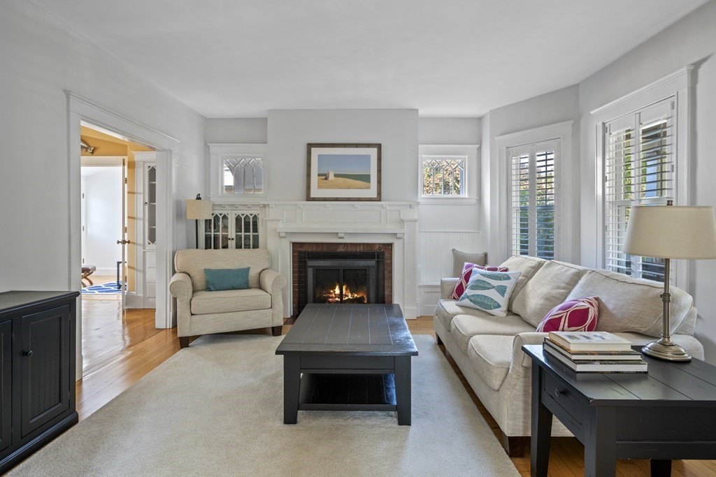 64 Farragut Road Swampscott, MA 01907 - Photo 4 of 35 a living room with furniture and a fireplace