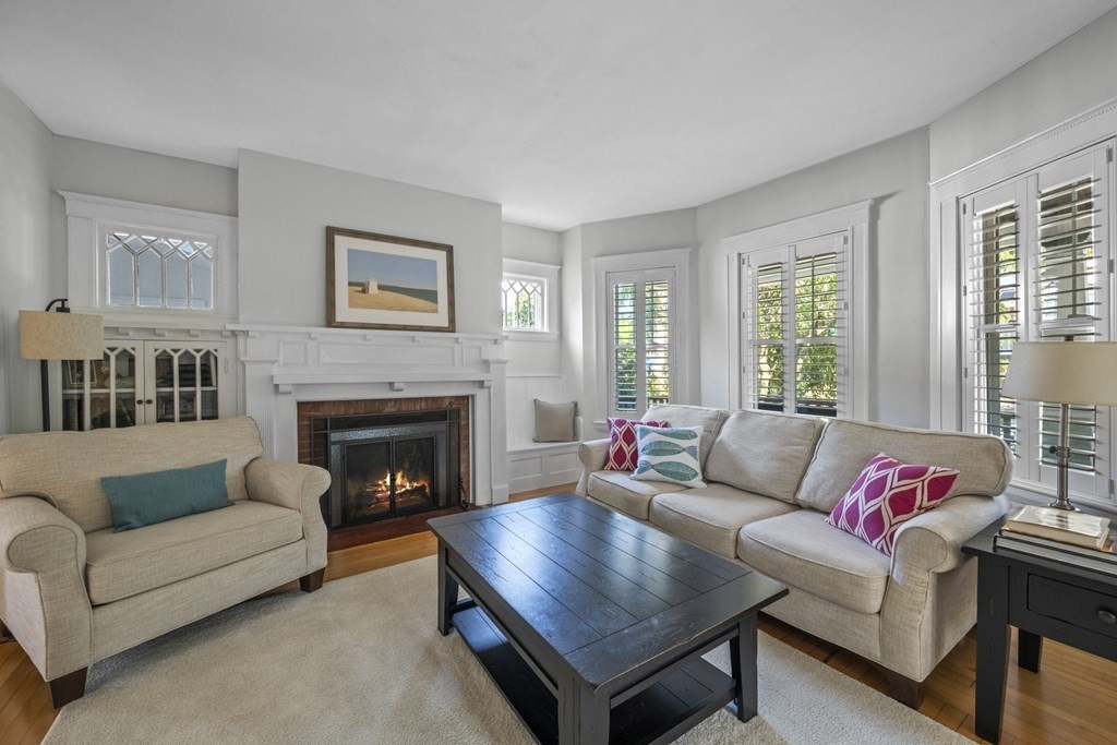 64 Farragut Road Swampscott, MA 01907 - Photo 5 of 35 a living room with furniture and a fireplace