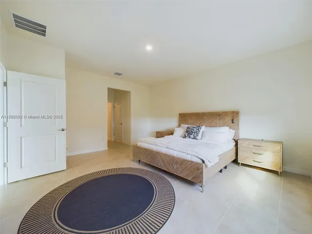 a bedroom with a bed and closet