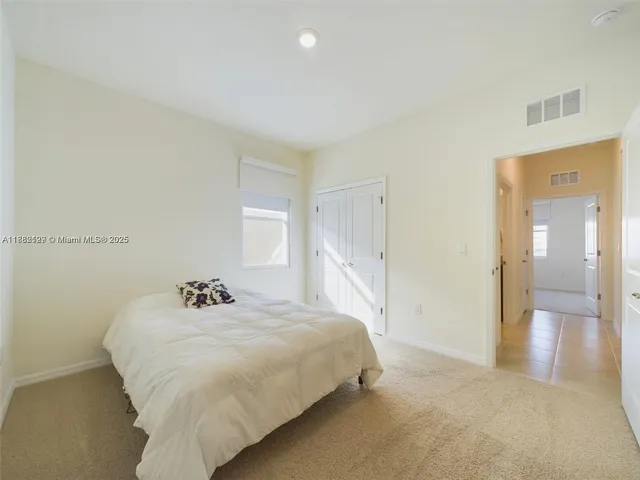 a bedroom with a bed and a cabinets