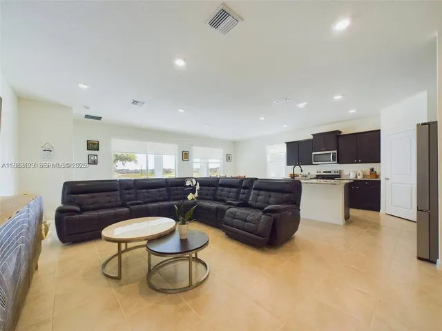 a living room with furniture and a couch