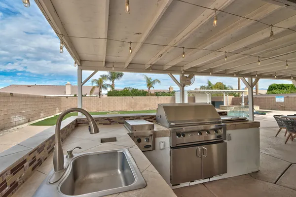 a patio with table and chairs