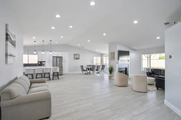 a kitchen with a sink stainless steel appliances and cabinets