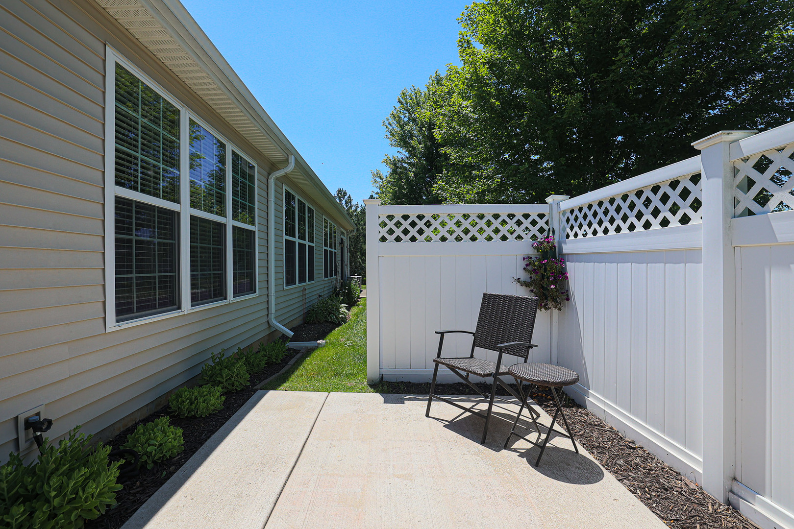 13553 Delaney Road Huntley, IL 60142 - Photo 23 of 29 a view of a chair and table in backyard of the house