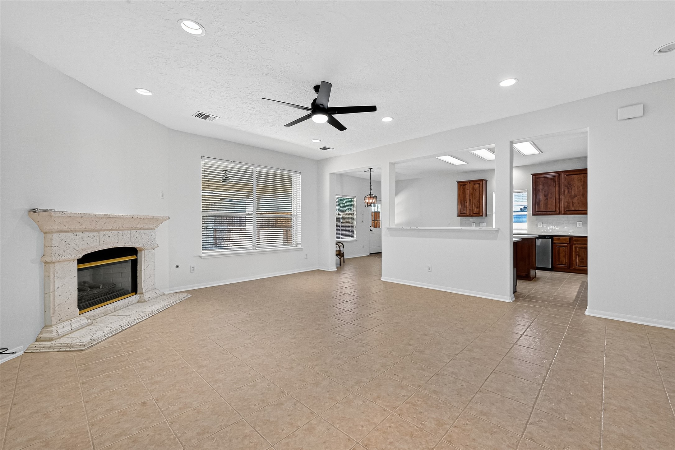 11727 Spring Path Court Tomball, TX 77377 - Photo 13 of 50 a view of a livingroom with a fireplace a sink and a living room