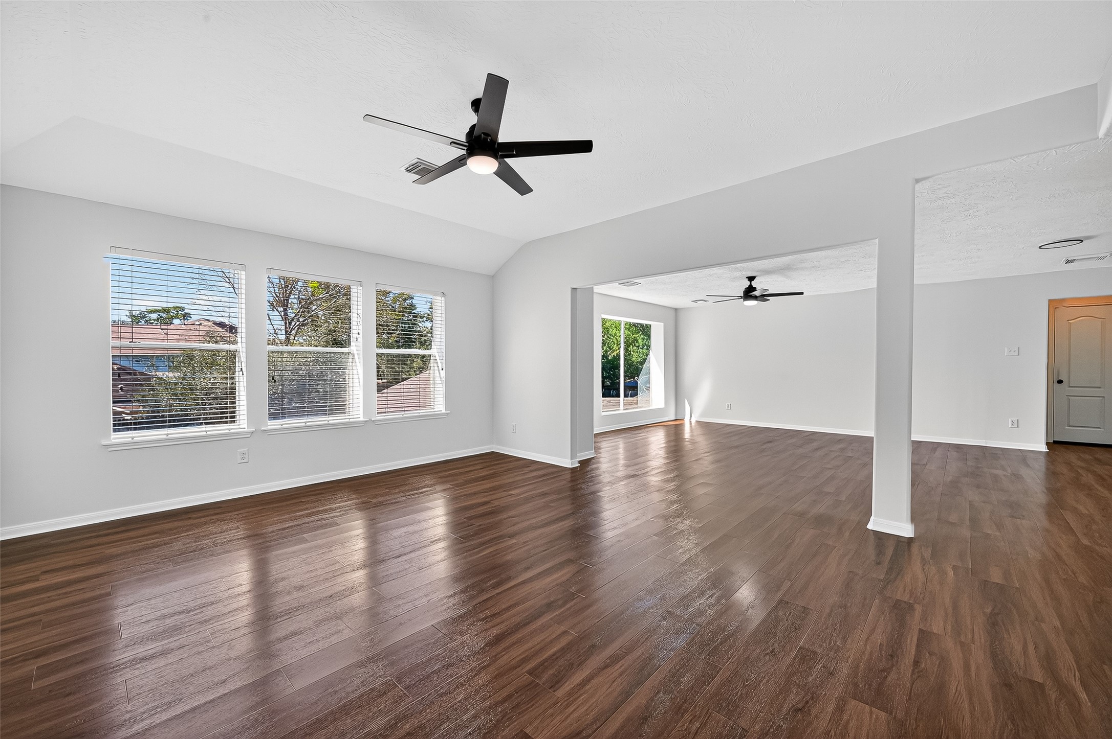 11727 Spring Path Court Tomball, TX 77377 - Photo 26 of 50 a view of empty room with wooden floor and window