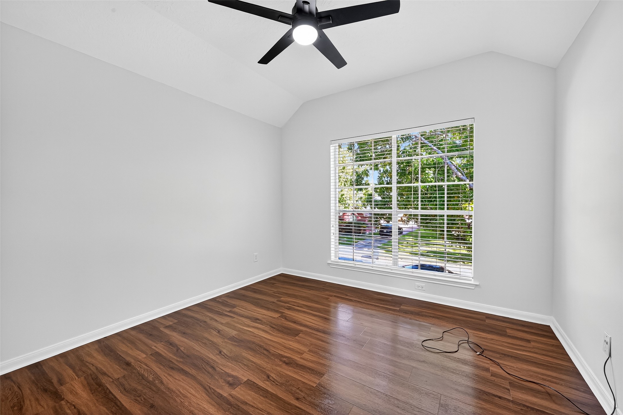 11727 Spring Path Court Tomball, TX 77377 - Photo 32 of 50 a view of a room with wooden floor and windows