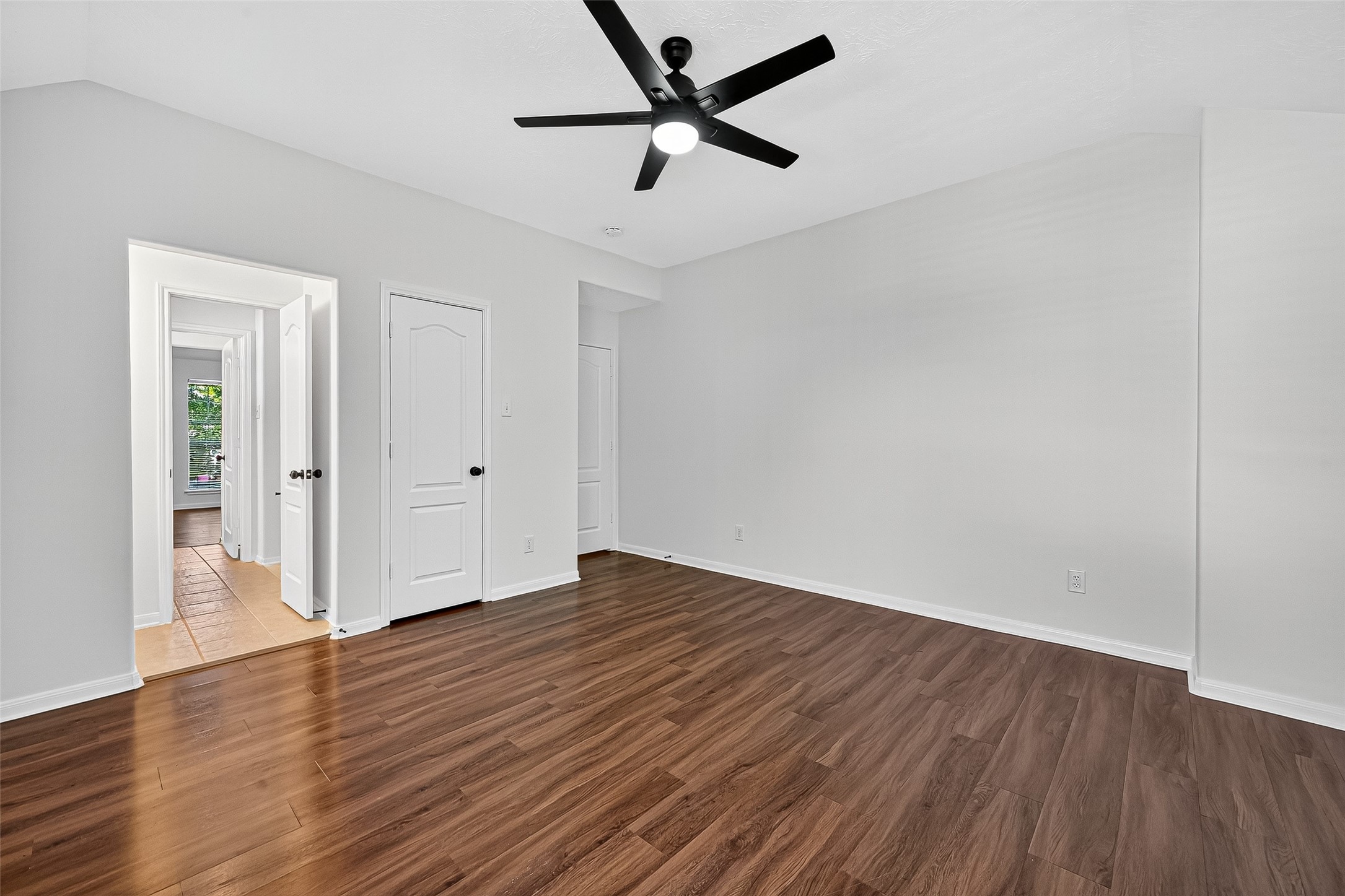 11727 Spring Path Court Tomball, TX 77377 - Photo 35 of 50 an empty room with wooden floor and windows