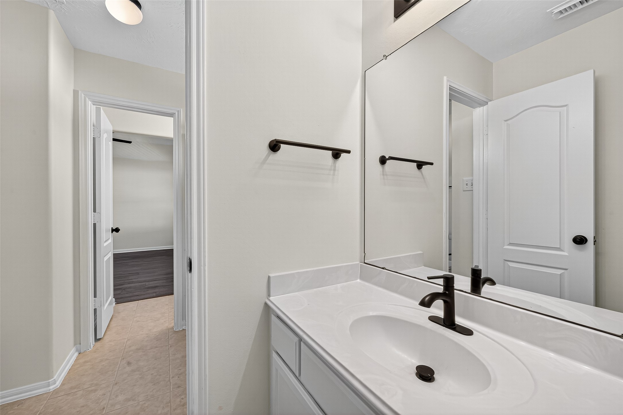 11727 Spring Path Court Tomball, TX 77377 - Photo 38 of 50 a bathroom with a sink and a mirror