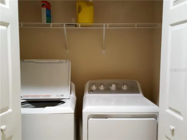 a utility room with dryer and washer