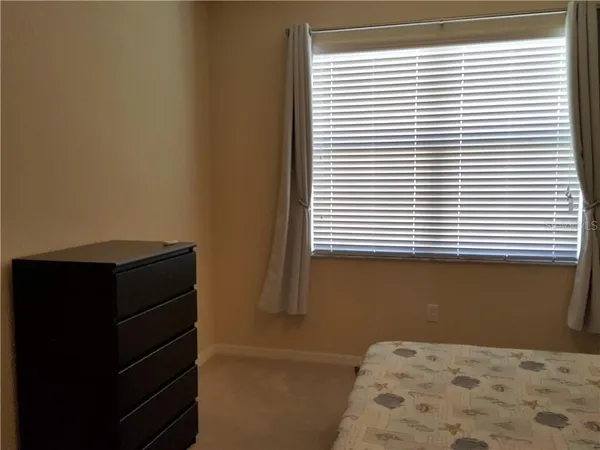 a bathroom with a window and a walk in closet