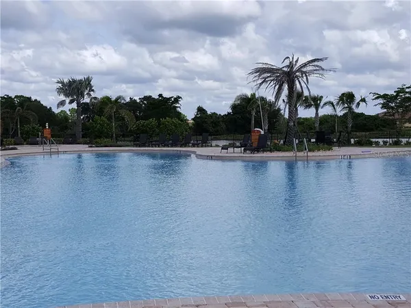a view of a lake and trees in the background