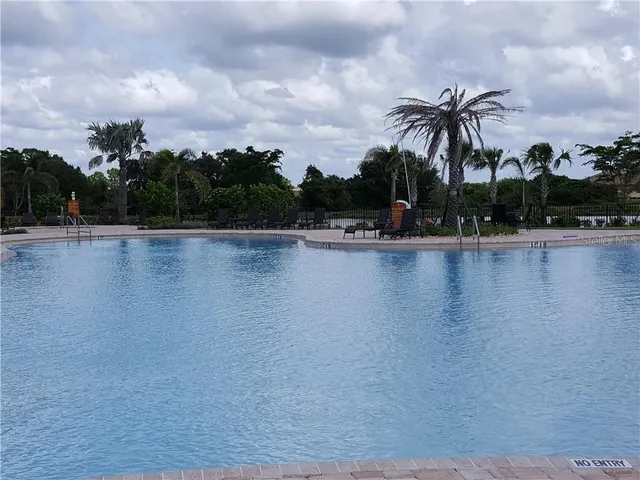 a view of a lake and trees in the background