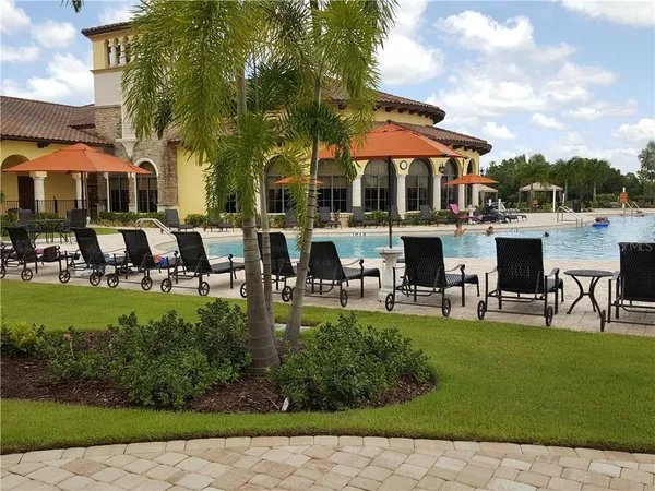 a table and chairs in front of the house