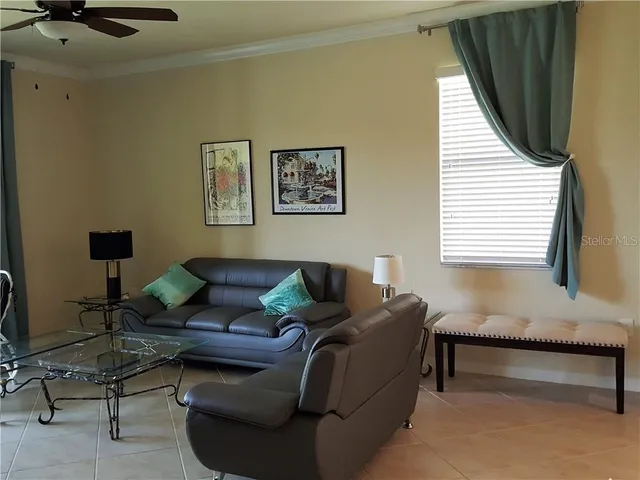 a living room with furniture and a window