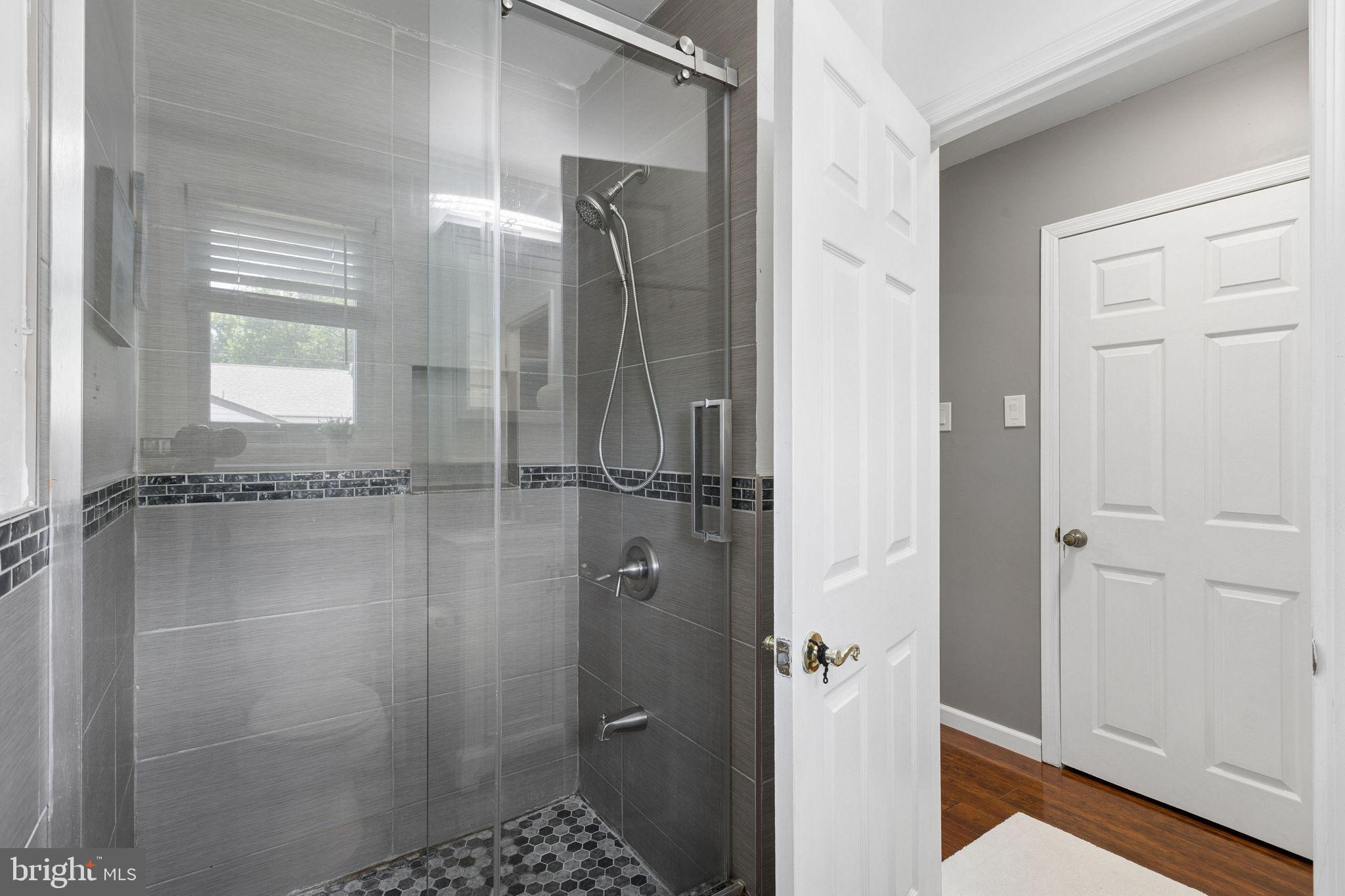 252 Sandringham Road Cherry Hill, NJ 08003 - Photo 19 of 31 a bathroom with a shower and a sink