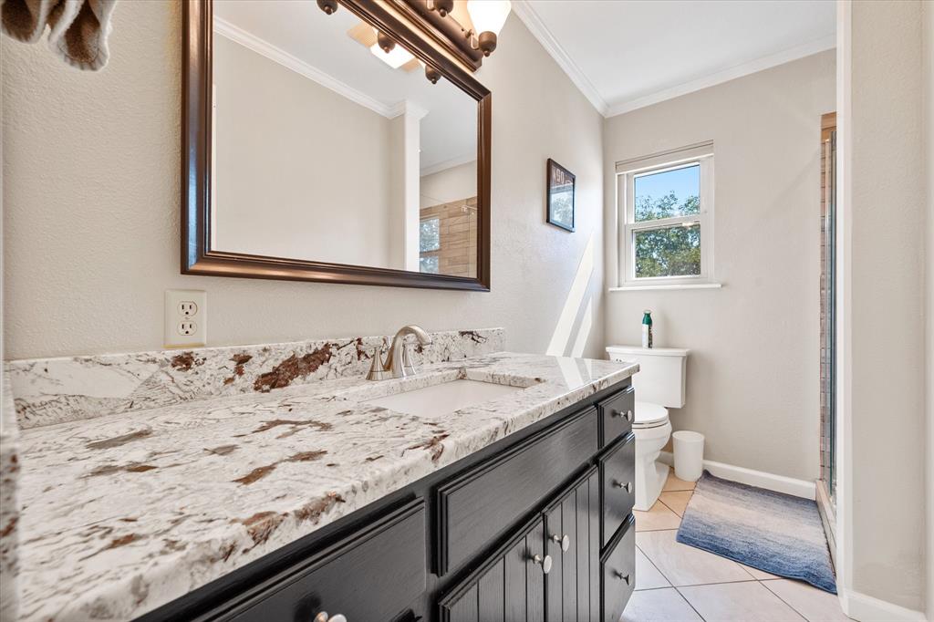 195 Highview Streetman, TX 75859 - Photo 16 of 40 a bathroom with a granite countertop sink and a mirror