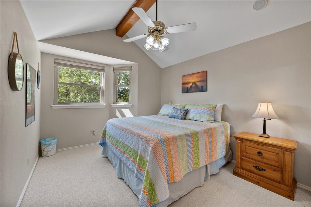 195 Highview Streetman, TX 75859 - Photo 19 of 40 a bedroom with a bed and a chandelier