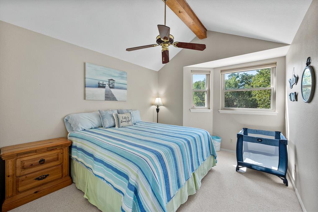 195 Highview Streetman, TX 75859 - Photo 20 of 40 a bedroom with a bed and a chandelier
