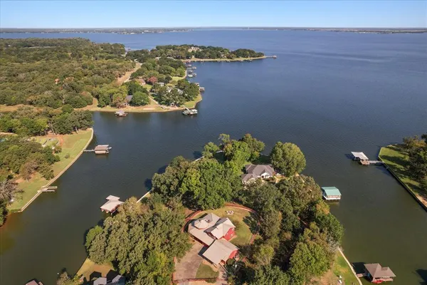 an aerial view of a house with a lake view