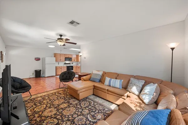 a living room with furniture and a rug