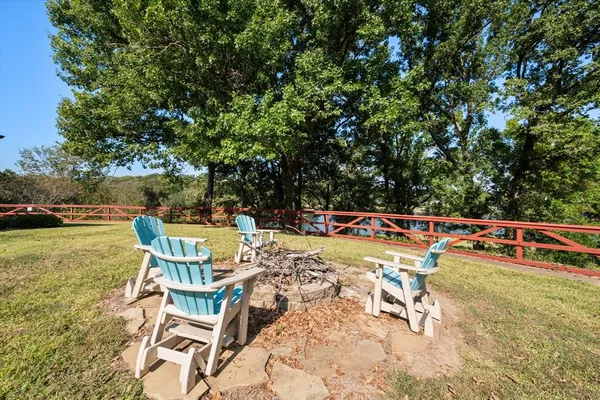 a view of swimming pool with chairs