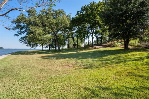 a view of a swimming pool with an outdoor space and seating area