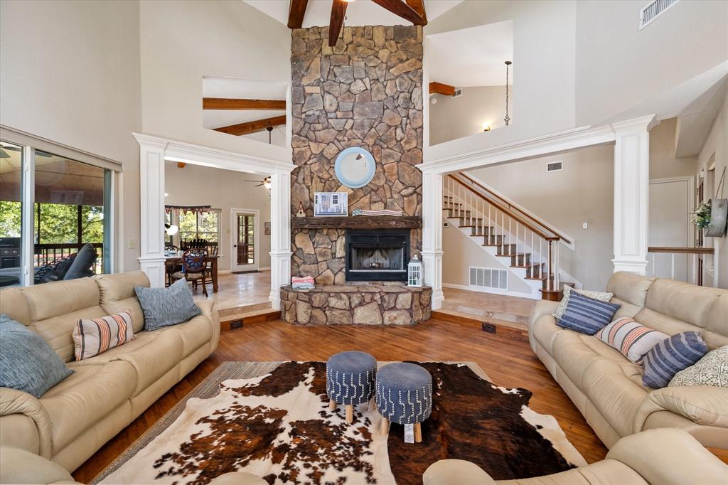 195 Highview Streetman, TX 75859 - Photo 4 of 40 a living room with furniture a rug and a fireplace