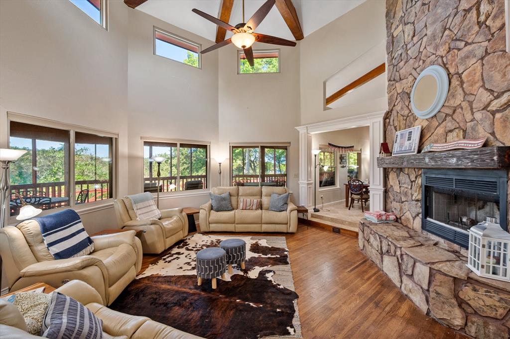 195 Highview Streetman, TX 75859 - Photo 5 of 40 a living room with furniture a fireplace and a large window