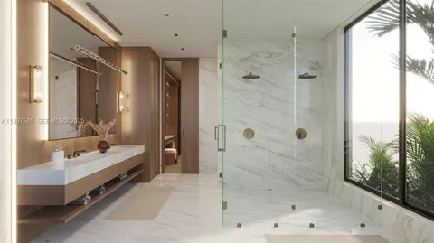 a bathroom with a double vanity sink mirror and shower