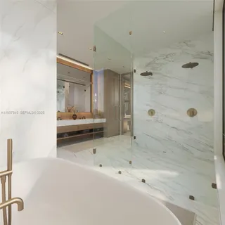 a bathroom with a tub and a shower