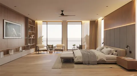 a living room with furniture and large windows