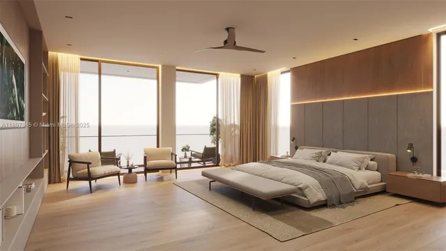 a large bedroom with a bed and large windows