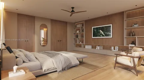 a bedroom with a bed couch and a window