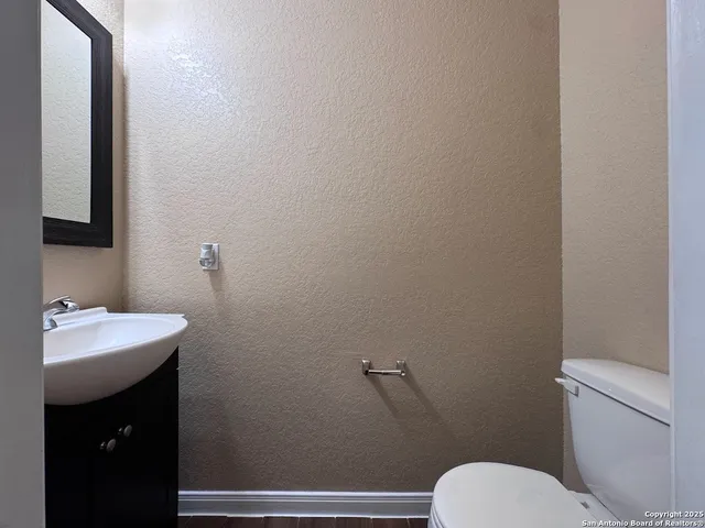 a bathroom with a sink and a toilet