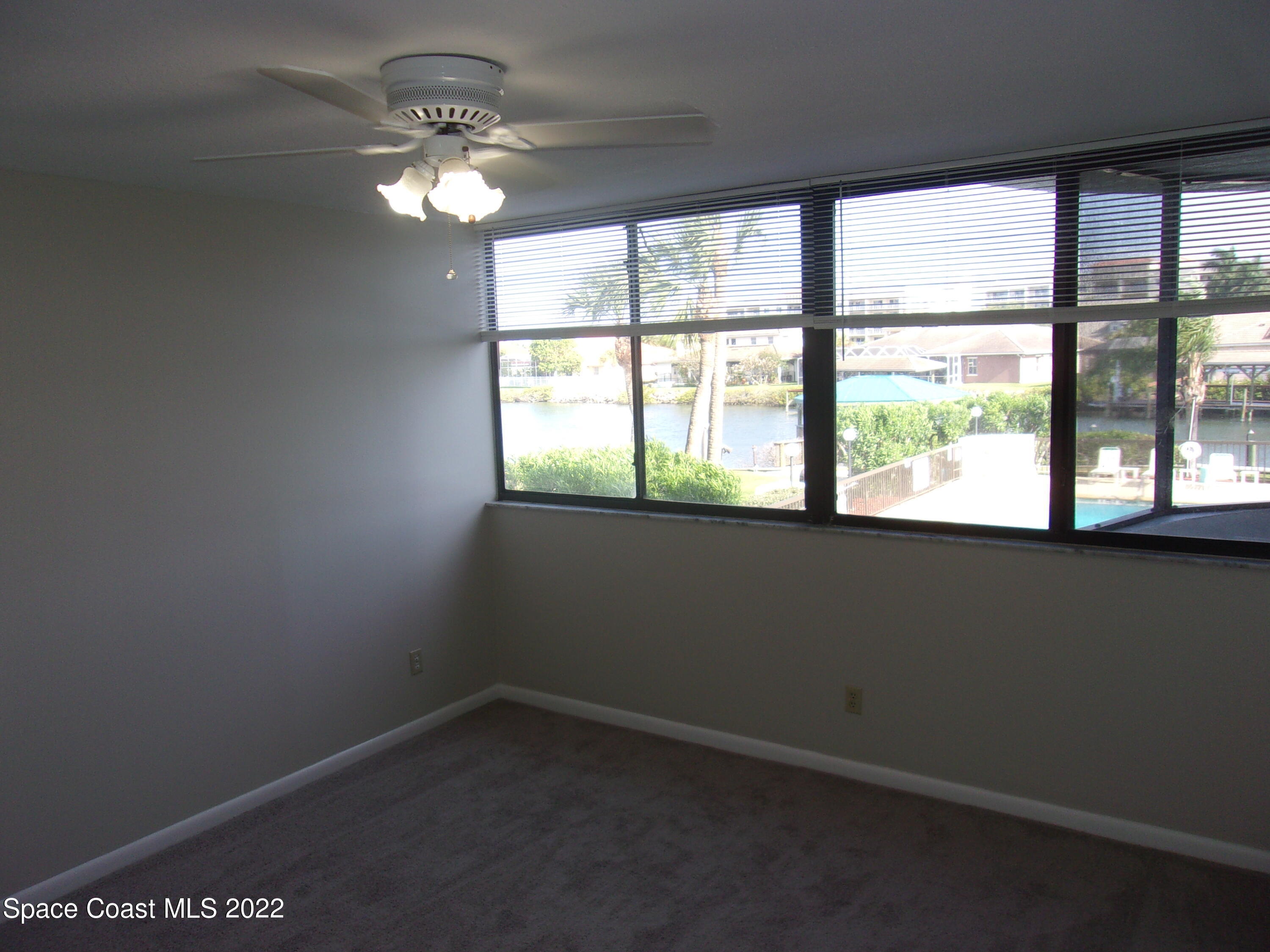 300 Columbia Drive, Unit 3202 Cape Canaveral, FL 32920 - Photo 11 of 16 an empty room with a window