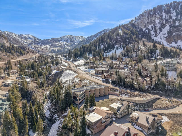 9699 Bypass Road, Unit 5 Alta, UT 84092 - Photo 49 of 54 Mountain community setting featuring a collection of properties amidst a forested, snow-dusted landscape