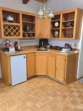 a kitchen with stainless steel appliances granite countertop a sink and a stove