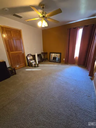 a view of an empty room with windows