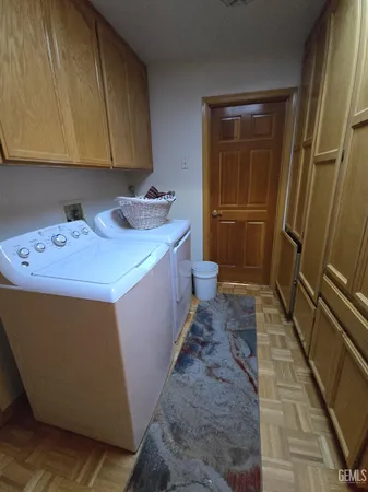 a utility room with a sink a washer and dryer