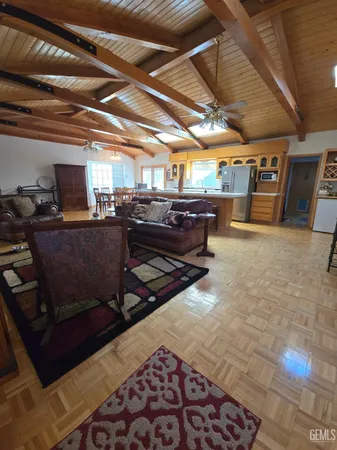 a living room with lots of furniture and a rug