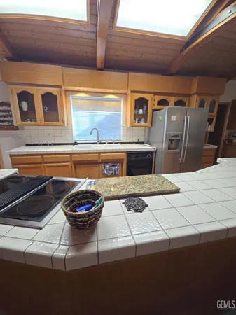 a kitchen with a stove and cabinets