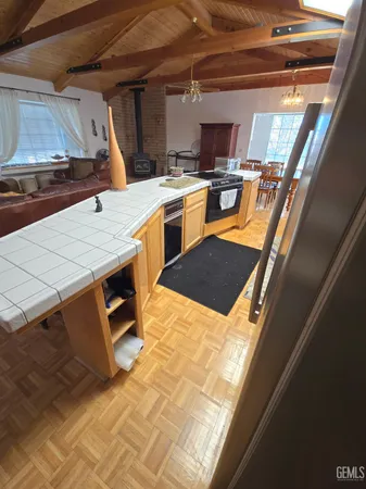 a view of a kitchen with wooden floor